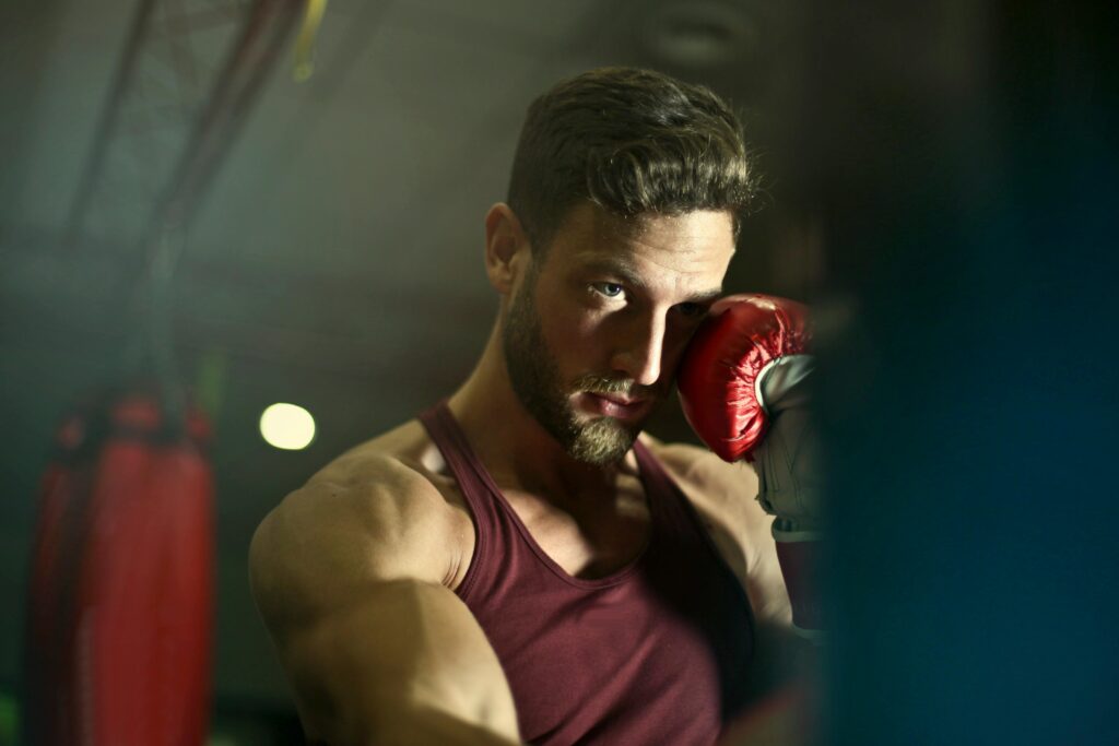 pexels photo 927437 927437 Bearded male boxer in gym focusing intensely during training session.